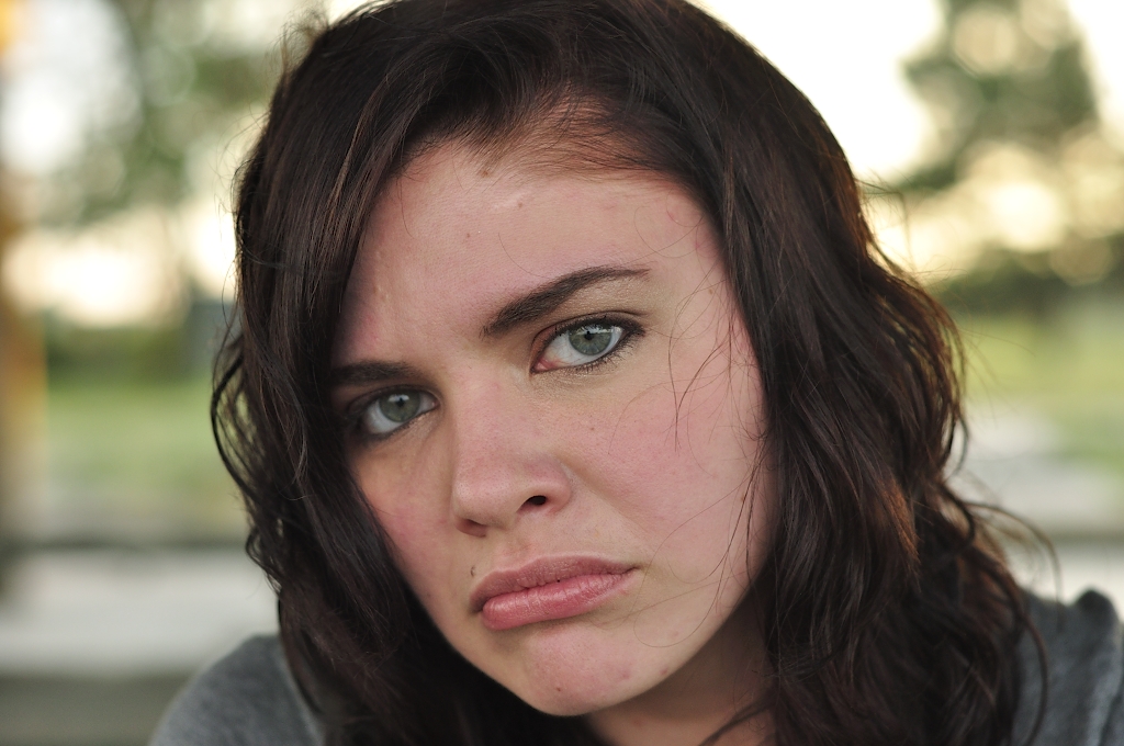 Girl Face Model Brown hair Curly Medium hairstyles Sad