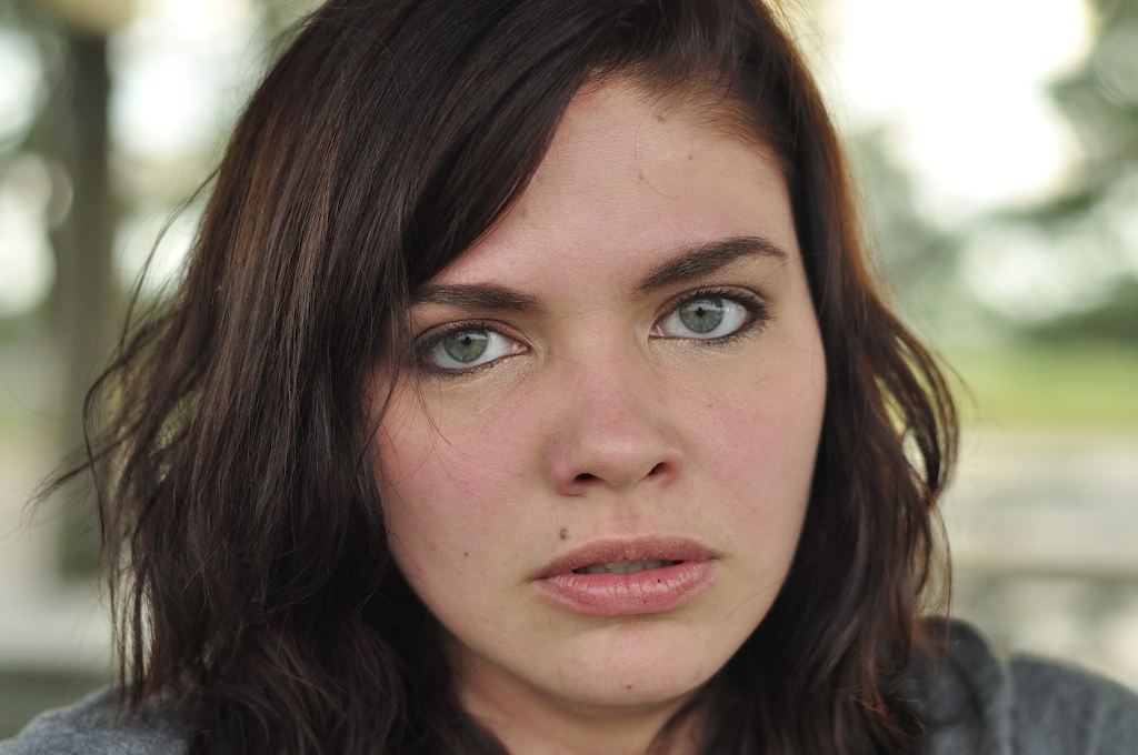 Girl Face Model Brown hair Curly White Medium hairstyles Angry